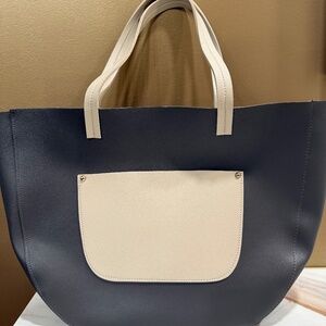 Large black and tan satchel, with front pocket, open top